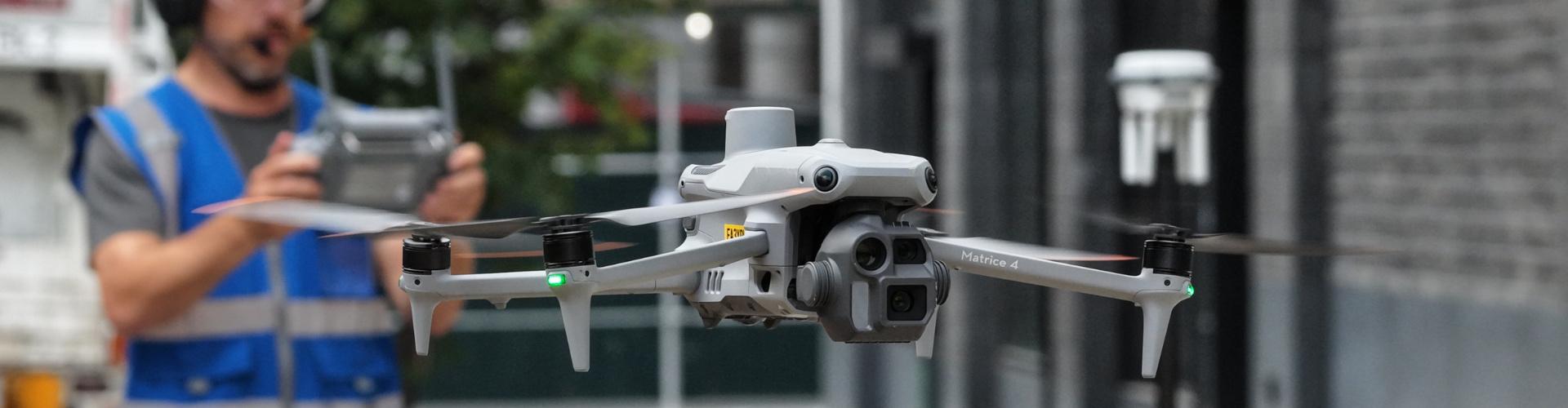 Drone Inspect NYC pilot preparing a Matrice inspection drone for flight